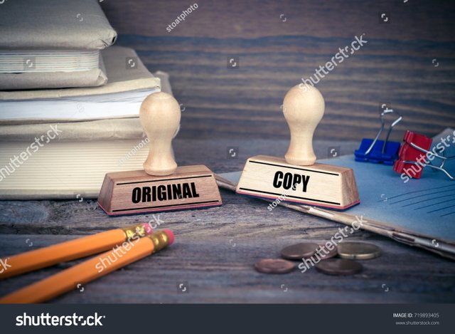 stock-photo-original-and-copy-concept-rubber-stamp-on-desk-in-the-office-business-and-work-background-719893405.jpg