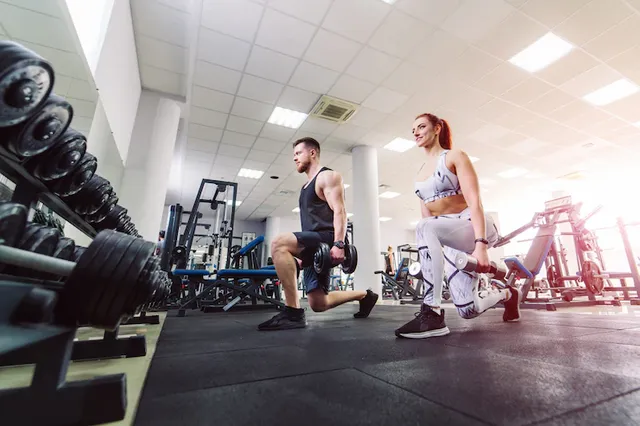 healthy-couple-sport-clothes-lifting-dumbbells-gym-attractive-woman-handsome-man-doing-workout-with-dumbbells-standing-special-pose-sports-club_116317-1345.webp