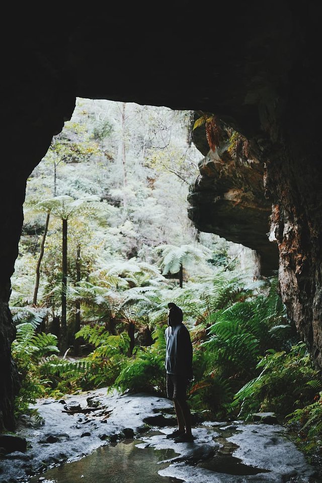 man-standing-at-cave-entrance.jpg