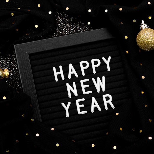 new-year-lettering-dark-background-with-lights.jpg