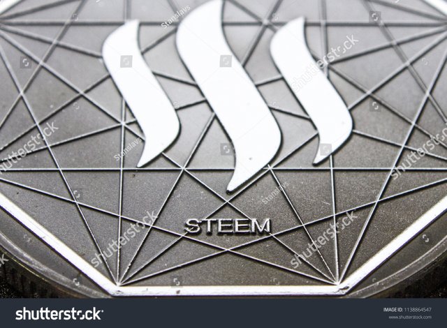 stock-photo-the-macro-silver-coin-cryptocurrency-a-steem-1138864547.jpg