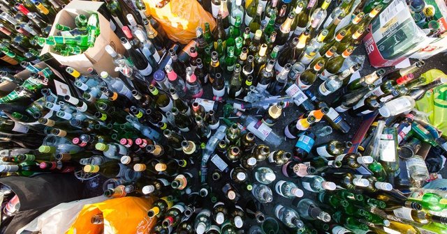 PAY--Hundreds-of-bottles-of-wine-champagne-and-other-alcoholic-drinks-line-the-floor-as-recycling-bins-are-full-to-the.jpg