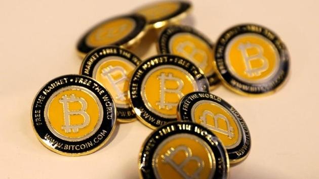 bitcoin-conference-buttons-consensus-blockchain-displayed-technology_3a433422-9d1d-11e8-9ea4-7619ca404631.jpg