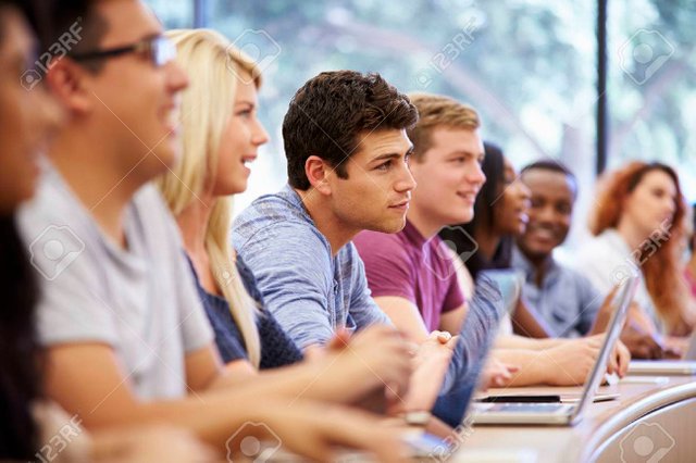 31054367-class-of-university-students-using-laptops-in-lecture.jpg