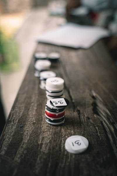 free-photo-of-close-up-of-a-stack-of-numbered-tokens-on-a-wooden-surface.jpeg