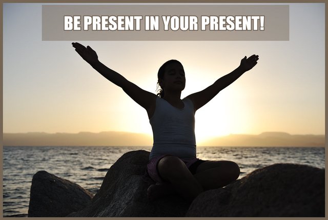 sunset in background with silloquette of woman arms stretch wide open be present in your present.jpg