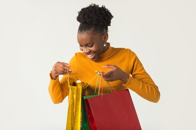 beautiful-young-african-woman-with-packages-her-hands_219728-297.jpg