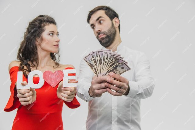 young-cute-couple-love-man-holds-money-his-hands-woman-with-wooden-word-love-isolated-white-background-valentines-day_1339901-2397.jpg