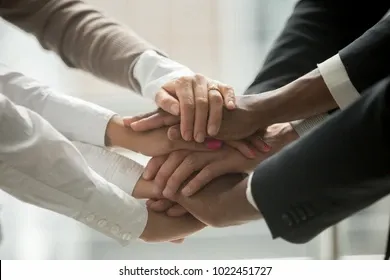 diverse-people-putting-stacked-hands-260nw-1022451727.webp