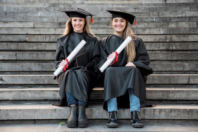 friends-sitting-stairs-looking-camera1.jpg