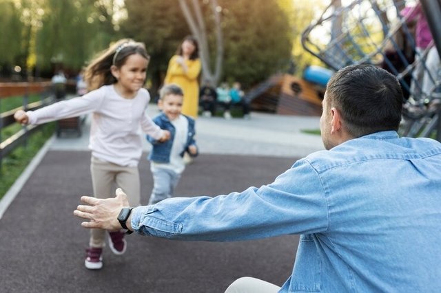 side-view-happy-father-with-kids.jpg