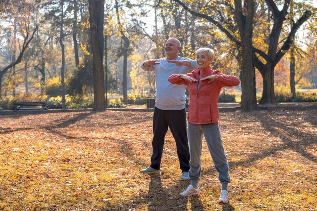 beautiful-picture-elderly-exercising-park_181624-51805.jpg