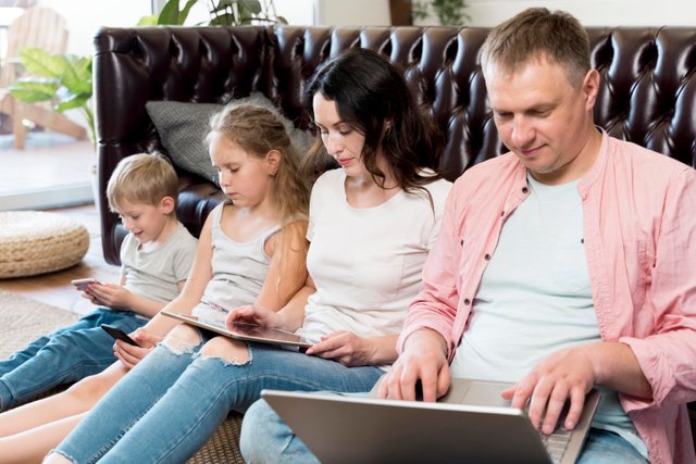 family-laying-floor-with-gadget.jpg