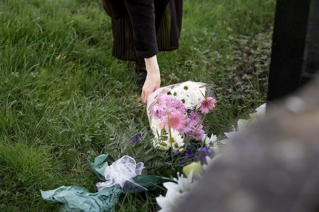 close-up-flowers-placed-grave-loved-one_23-2149125568.jpg