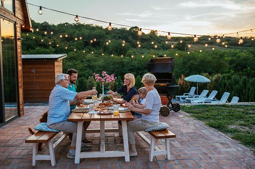 multi-generations-family-gathering-at-dinner-party-in-the-backyard.jpg