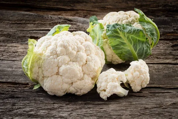 depositphotos_325537288-stock-photo-organic-cauliflower-on-wooden-background.jpg