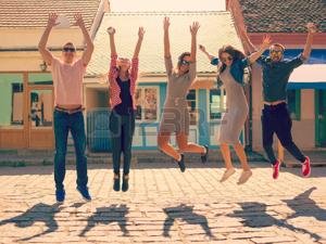 46982610-friendship-and-summer-holidays-concept-group-of-teenagers-having-good-fun-on-the-city-streets-jumpin.jpg