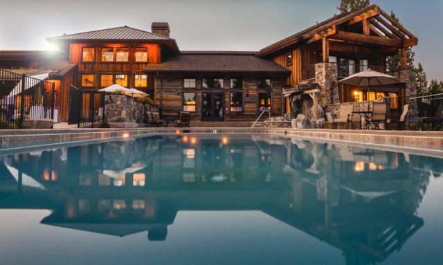 Canva - Brown Wooden House Infront of Swimming Pool Under Blue Sky.jpg