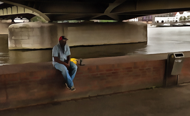 Maastricht juli 2018 Unknown man sitting under bridge uitsnede 1.png