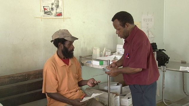 A_TB_patient_is_given_daily_treatment_at_the_Mabuduan_Health_Centre_in_the_Western_Province_-_Photo_AusAID_(10663956573).jpg