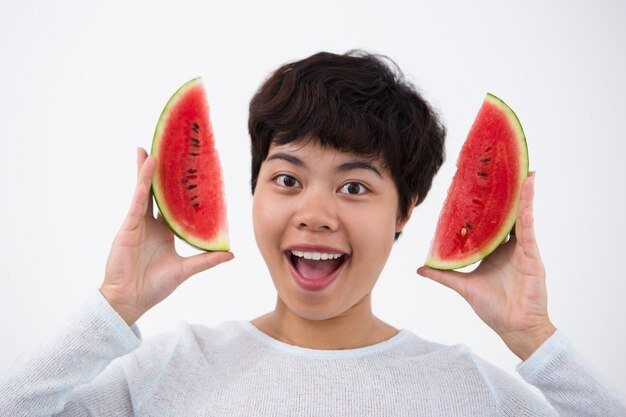 playful-asian-girl-holding-slices-watermelon_1262-5293.jpg