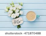 stock-photo-coffee-mug-with-white-flowers-and-notes-good-morning-on-blue-rustic-table-from-above-beautiful-471870488.jpg
