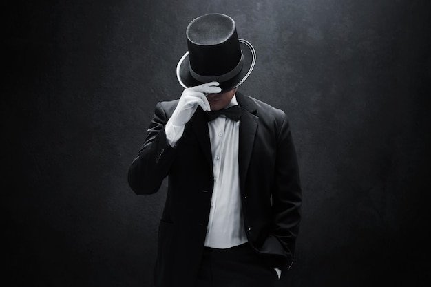 mysterious-man-black-suit-dark-background_1024307-2280.jpg