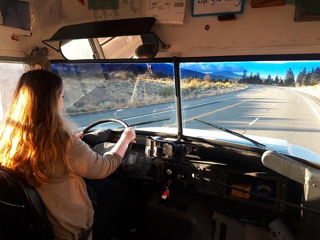 mary-driving-big-blue-skoolie-bus.jpg