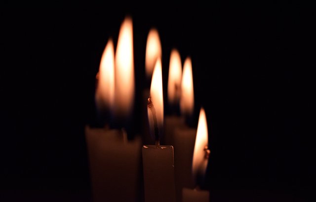 candles-lit-in-dark_4460x4460.jpg