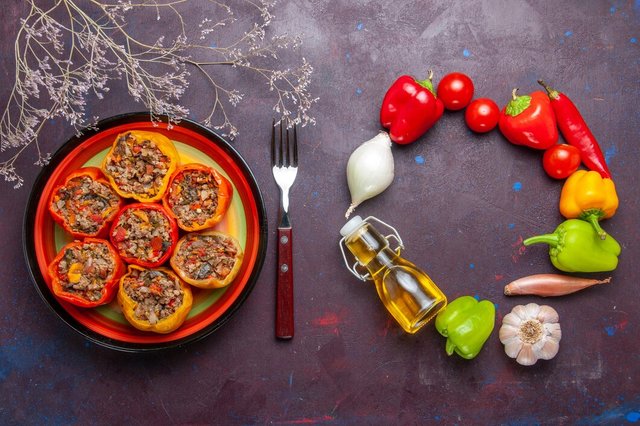 top-view-cooked-bell-peppers-with-different-seasonings-grey-desk-beef-dolma-food-vegetables-meat_140725-74510.jpg