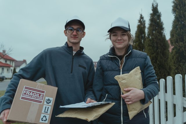 2 workers smiling with caps.jpg