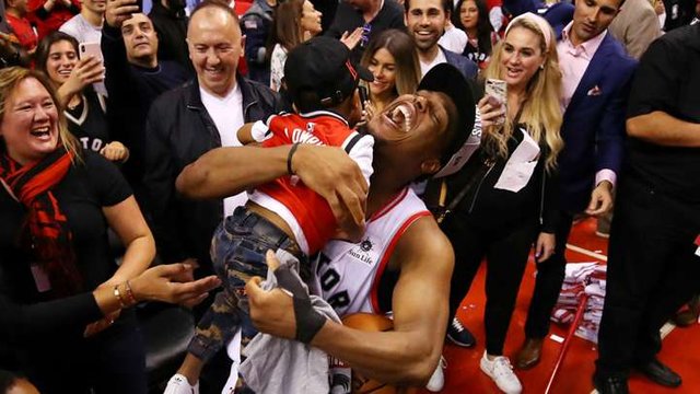 kyle-lowry-celebrates-with-one-of-his-sons-after-the-raptors-clinched-a-spot-in-the-nba-finals-with-a-game-6-win-over-the-bucks_1nvz08f4k2cd71ahgkp7ucg5sf.jpg