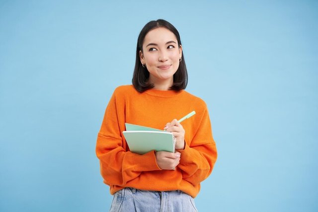 beautiful-asian-girl-student-taking-notes-writing-down-studying-courses-learning-standing-bl_1258-168662.jpg