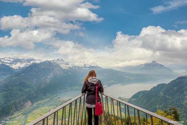 Woman-looking-to-Interlaken-panorama-from-viewpoint-at-Harder-Kulm.jpg