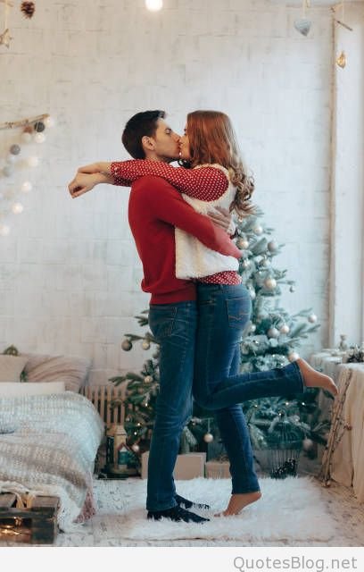 young-couple-hugging-and-kissing-over-Christmas.jpg