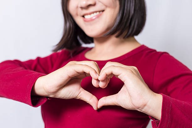 woman-show-heart-hands-picture-id498408168.jpeg