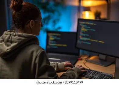 back-view-female-programmer-using-260nw-2099118499.webp