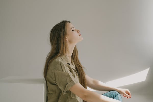 free-photo-of-beautiful-girl-with-long-hair-and-closed-eyes-sitting-on-a-floor-meditating.jpeg