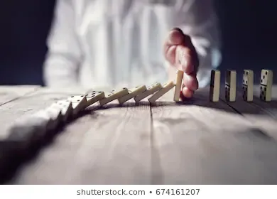 stopping-domino-effect-concept-business-260nw-674161207.jpg