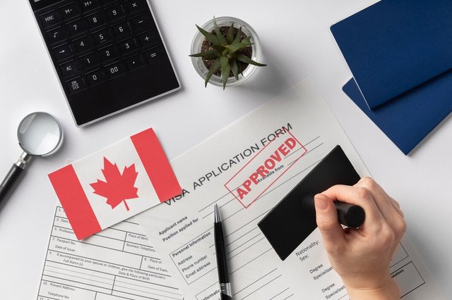 visa-application-composition-with-canadian-flag_23-2149117799.jpg