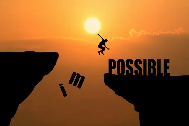 man-jumping-impossible-possible-cliff-sunset-background-business-concept-idea_1323-265.webp