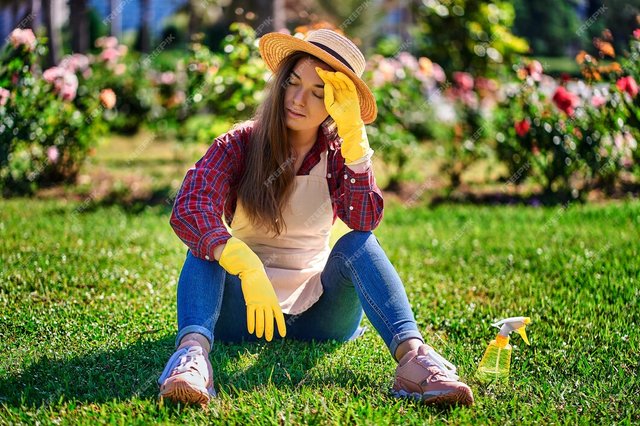 tired-woman-gardener-sitting-grass_122732-3336.jpg