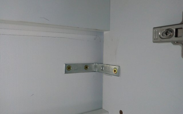 Securing the Vanity unit to the wall.jpg
