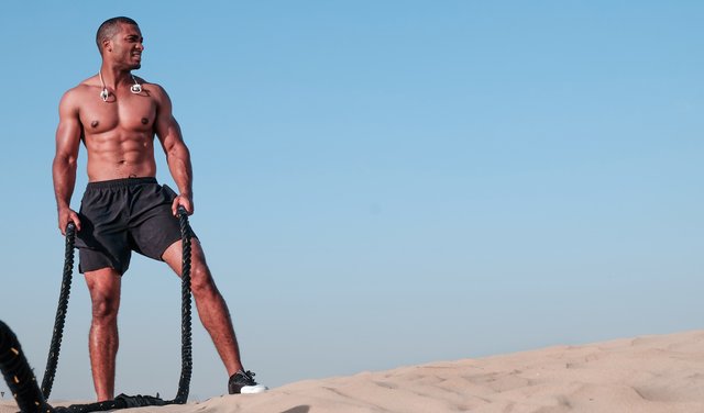 Canva - Photo of Shirtless Man Holding Rope.jpg