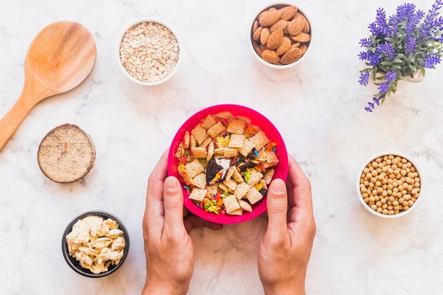 hands-holding-bowl-with-cereal_23-2147961715.jpg