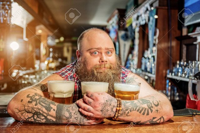 77187298-surprised-man-hugging-glasses-of-beer.jpg