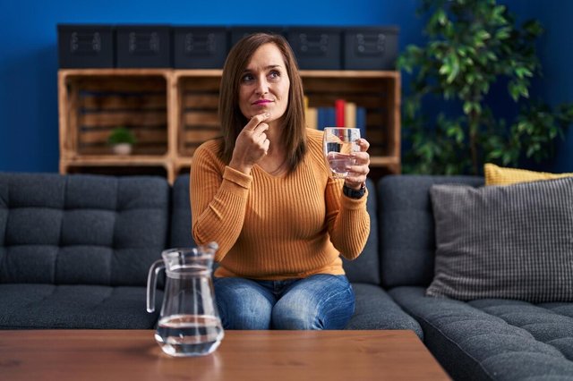 middle-age-woman-drinking-glass-water-serious-face-thinking-about-question-with-hand-chin-thoughtful-about-confusing-idea_839833-4483.jpg