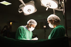 free-photo-of-two-surgeons-in-green-scrubs-are-working-in-an-operating-room.jpeg