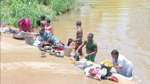 Some-commnity-people-in-Akwa-Ibom-doing-their-laundry-at-a-local-stream-min-scaled.jpg
