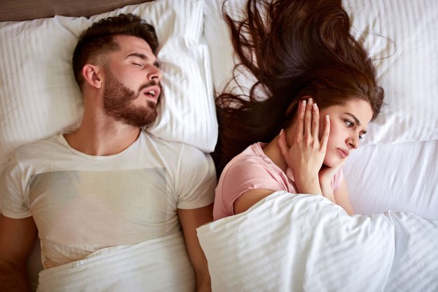 Young-couple-have-problem-with-man's-snoring.jpg